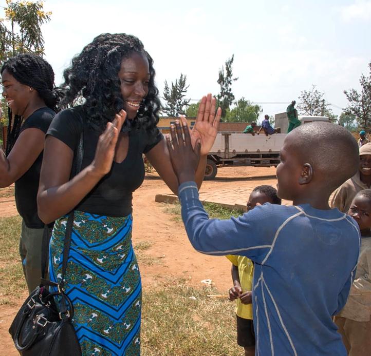 Students playing with Rwandan children