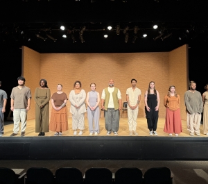 Cast of Antigone on stage